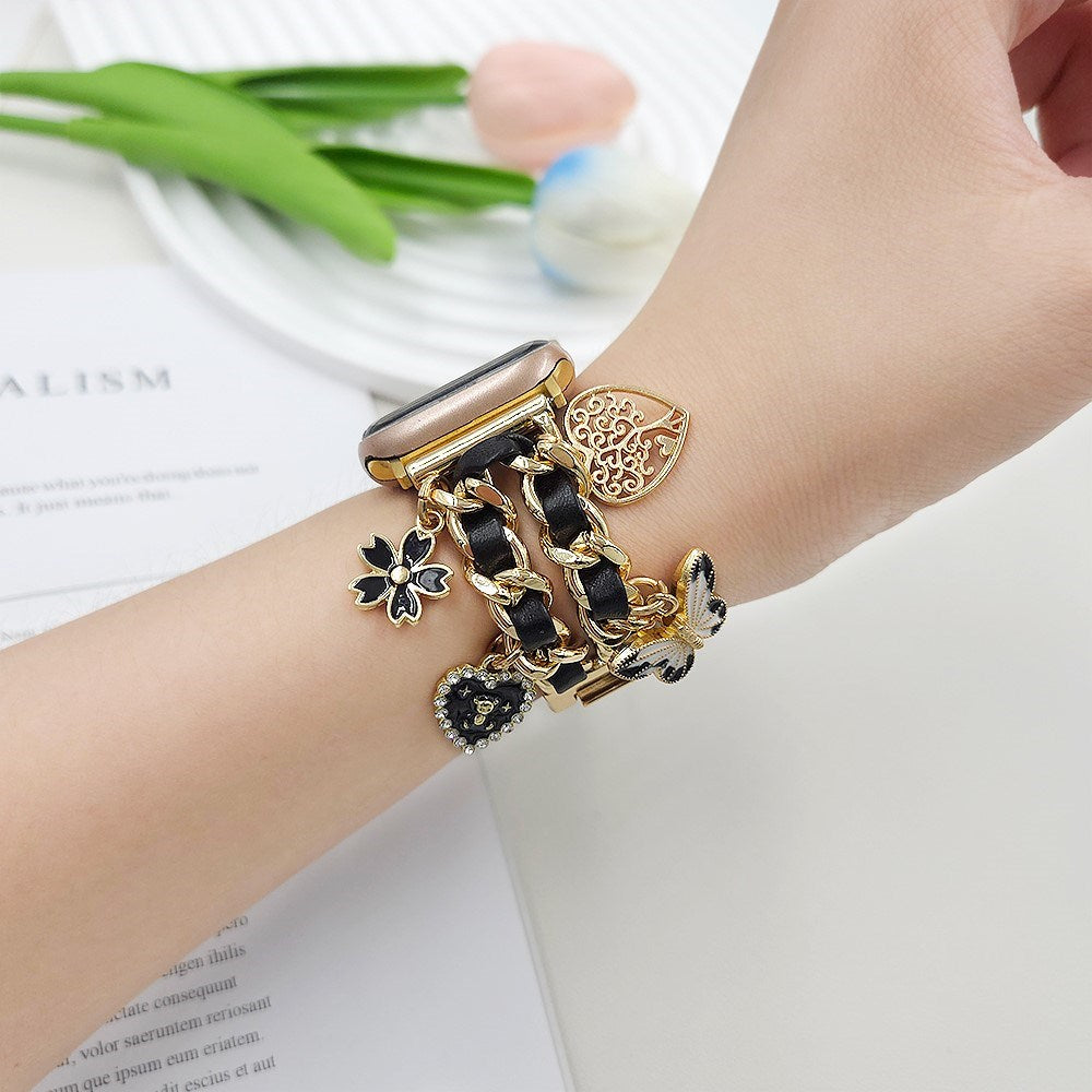 EIDERWOOD Apple Watch (38 / 40 / SE / 41 / 42mm) Metall Rem m. Kunstskinn & Vedheng - Gull / Svart