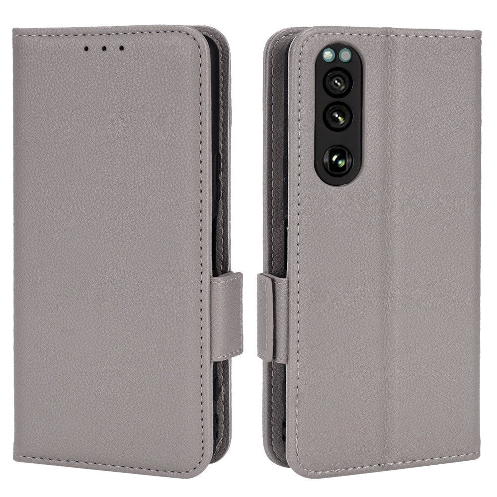 Sony Xperia 5 IV PU Litchi Skin Flip Deksel med Lommebok - Grå