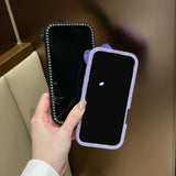 EIDERWOOD iPhone 16 Hybrid Deksel med 3D Sløyfe og Rhinestones - Gjennomsiktig / Svart